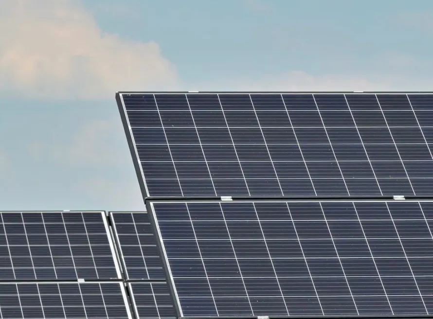 A close-up of solar panels against a blue sky